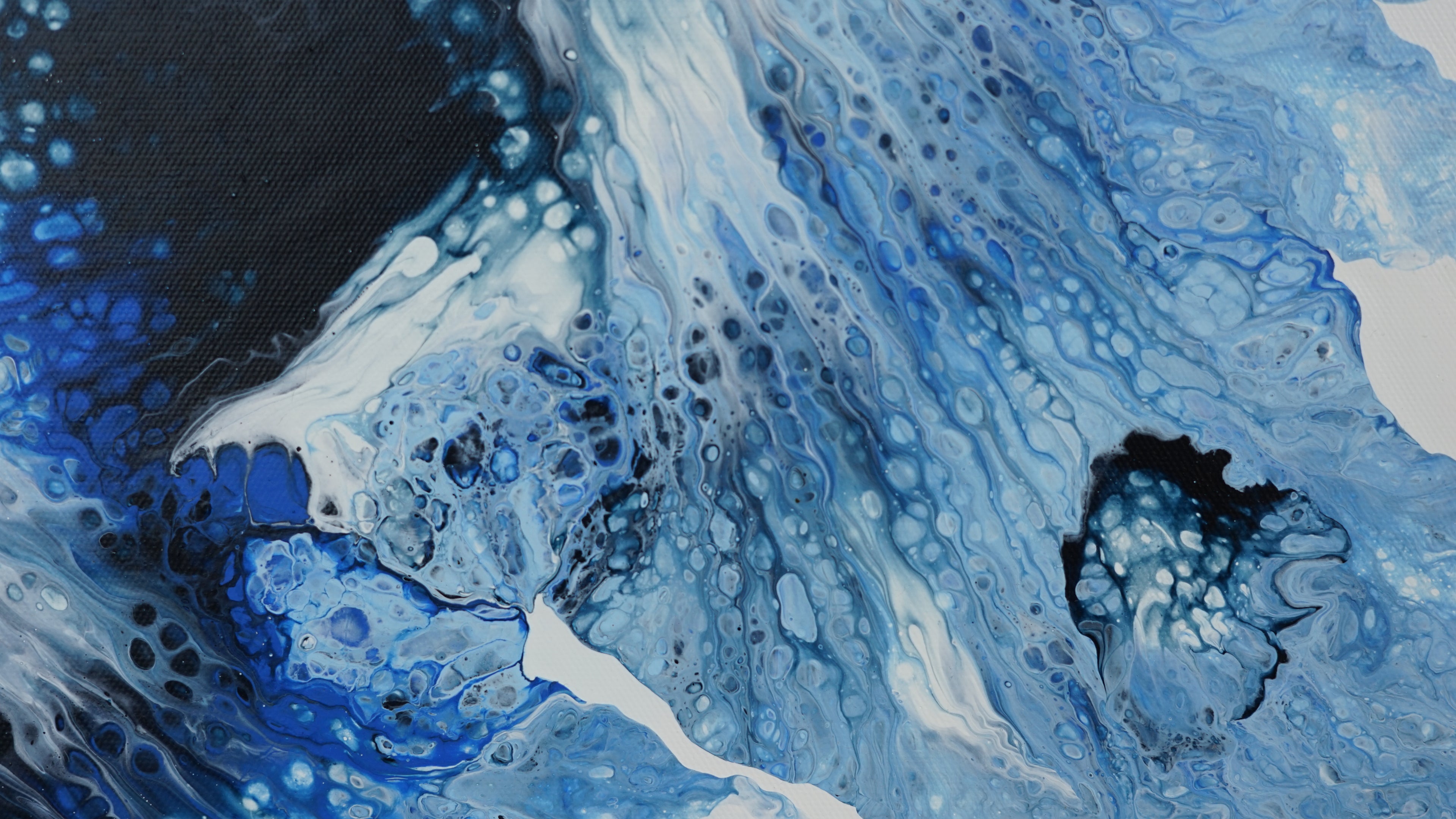 Abstract art with blue, black, and white colors
