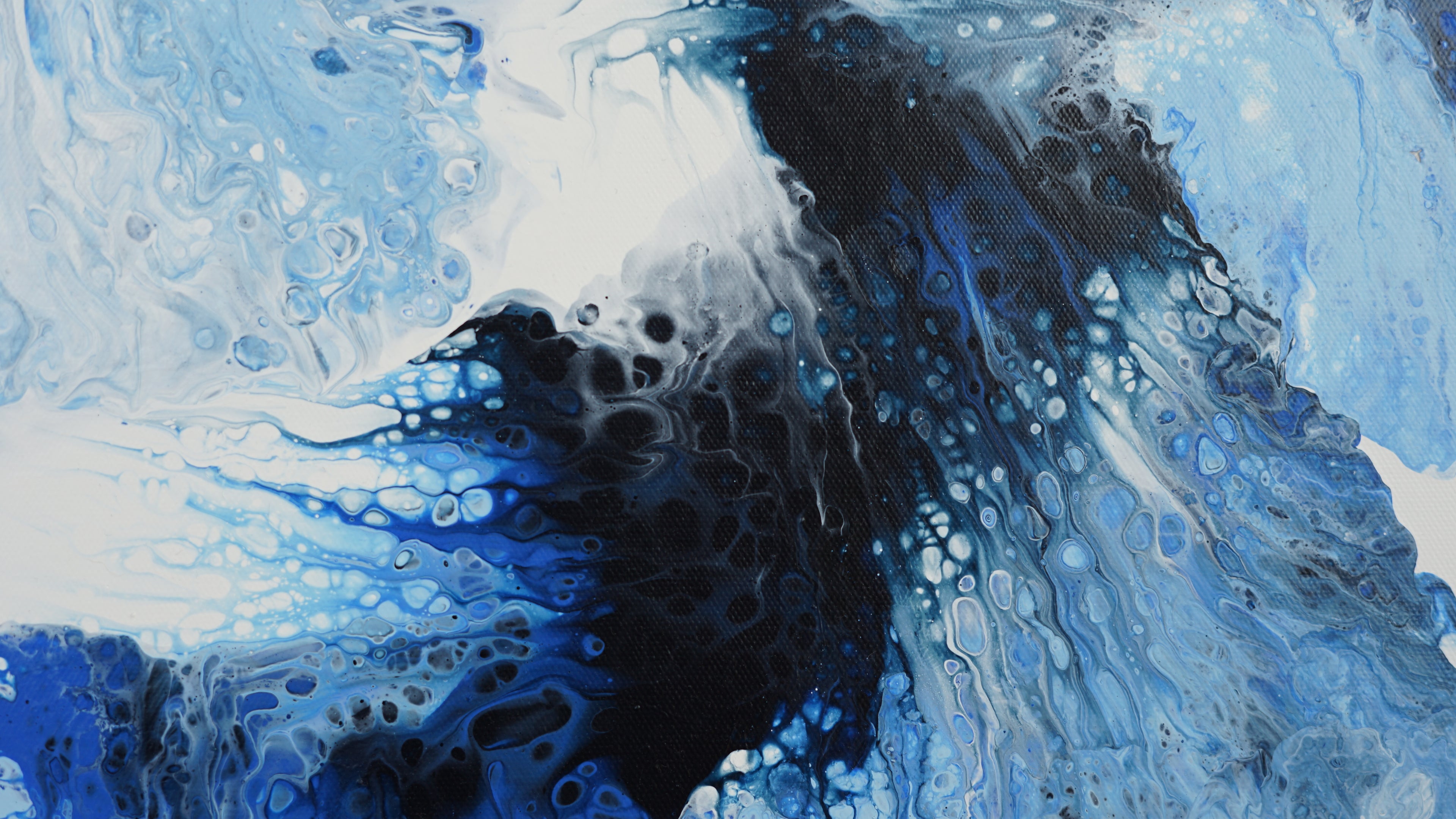 Abstract art with blue, black, and white colors